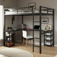 a black loft bed with desk underneath it