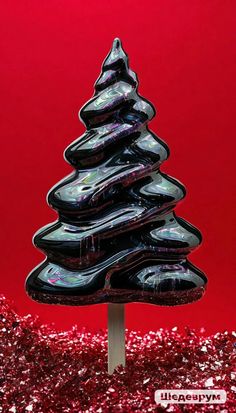 a black christmas tree on a red background