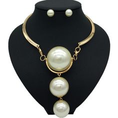 Description Here is a stylish Gold Pearl Necklace which not only modifies your look but also adds value to your personality. The Pearl has a soft glamour which makes it look very beautiful. There are two colors on this necklace available which are Gold and Silver. One can wear these necklaces for any occasion or ceremony. Features Material:Metal, Copper Alloy Pattern:Geometric Color:Gold /silver Pendant material:Pearl What Includes 1*Necklace 1 Pair ofEarrings Measurement Earrings Height: 0.90 i Chic White Choker Jewelry, Elegant Alloy Necklaces For Party, Elegant Party Necklaces In Alloy, Elegant Pearl Necklace For Party, Chic White Pearl Jewelry, Elegant Pearl Pendant Necklace For Parties, Elegant Pearl Dangle Necklace For Party, Elegant Dangle Pearl Necklace For Parties, Elegant Dangle Choker For Parties