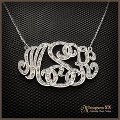 Personalized gold and diamond monogram necklace 1.0 inch high, 1.5 wide and about 1mm thick, made of solid 14kt. white gold and has a total of 0.80ct. in diamonds. The necklace suspends from a cable Link chain with 3 choices of length: 14,16 and 18. The Monogram can be made with the initials of your Elegant Nameplate Initial Necklace For Anniversary, Personalized Silver Cubic Zirconia Jewelry, Silver Pendant Initial Necklace In Fine Jewelry, Luxury White Gold Pendant Name Necklace, Silver Custom Necklace With Diamond Accents For Anniversary, Custom Silver Necklace With Diamond Accents For Anniversary, Elegant Jewelry For Anniversary Gift With Hallmarks, White Gold Initial Necklace For Anniversary, Personalized Silver Diamond Name Necklace