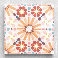 an artistic tile design with orange, red and blue flowers on white background that looks like hexagonal tiles