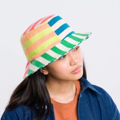 Knit bucket hat with colorblock stripe patchwork. Made from colorful, soft hypoallergic yarn. From sunny summer beach days to cold winter walks, this bucket hat is destined for year-round wear. Each hat is one of a kind – patchwork pattern placement may vary, but that's the fun of it! Fully lined. Details Body: 100% Acrylic Lining: 100% Deadstock poly-cotton fabric Machine wash gentle, lay flat to reshape and dry8.5"w, 3.5"h, 2.25" brim, 22" interior circumference Stripe Patchwork, Knit Bucket Hat, Winter Walk, Patchwork Patterns, Ux Web Design, Beach Days, Web Development Design, Striped Knit, Design Development