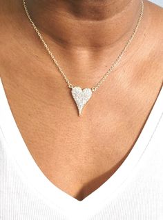 Do you want to feel the sparkle and joy of love? Look no further than the Amara Heart Diamond necklace – your new favorite piece of jewelry! This brilliant necklace features a heart-shaped cubic zirconia with a gorgeous shiny finish. The diamond-like beauty of this necklace is sure to make heads turn! Plus, its rhodium-plated or gold-plated 16" plain chain with a 2" extender provides flexibility should you want to layer it with other necklaces. Experience its beautiful sparkles for yourself and Valentine's Day Party Heart Necklace In Cubic Zirconia, Diamond Heart Pendant Jewelry For Party, Heart Pendant Diamond Jewelry For Party, Diamond Heart Pendant For Party, Heart Cut Cubic Zirconia Party Necklace, Heart Cut Cubic Zirconia Necklaces For Party, Heart Cut Cubic Zirconia Party Necklaces, Wedding Heart Necklace In Diamond White Cubic Zirconia, Heart Cut Cubic Zirconia Necklace For Party