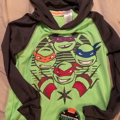 Ninja Turtle Long Sleeve Shirt Boys Size 8 Nwt Casual Tops With Character Print For Playtime, Sporty Long Sleeve Tops With Character Print, Casual Hooded Top With Character Print, Green Long Sleeve T-shirt With Character Print, Playful Green Top For School, Playful Green Tops For School, Long Sleeve Character Print Playtime T-shirt, Sporty Long Sleeve Playwear Top, Sporty Long Sleeve Tops For Playwear