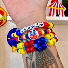 Clown kandi clowncore beaded bracelet set primary color jewelry accessories  Handmade clown beaded bracelet set of 3 with clown emoji charm and alpha beads that say clown  Bright primary colors  Tags; clown clowncore kidcore accessories jewelry bracelets kandi kid rave clown costume pony beads Customizable Fun Multicolor Beaded Bracelets, Fun Customizable Multicolor Beaded Bracelets, Novelty Plastic Bracelets With Round Beads, Playful Plastic Bracelets With Letter Beads, Playful Plastic Jewelry With Letter Beads, Playful Plastic Beaded Bracelets, Fun Customizable Multicolor Stretch Bracelet, Customizable Multicolor Stretch Bracelet, Fun Plastic Beaded Bracelets With Letter Beads