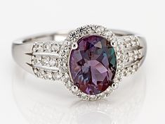 Pre-Owned 1.83ct oval color change lab created alexandrite with .31ctw round white zircon, rhodium over sterling silver ring Measures approximately .66"L X .44"W. Not sizeable. .  This product may be a customer return, vendor sample, or on-air display and is not in its originally manufactured condition.  It may not be new.  In some instances, these items are repackaged by JTV. Multi Gemstone Ring Jtv, Healthy Partner, Alexandrite Jewelry, Broken Chain, Pearl Strands, Faceted Gemstones, Types Of Rings, Gemstone Colors, Sterling Silver Ring