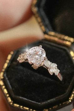 Our breathtaking 1.5ct round Moissanite Engagement Ring is crafted in luxurious 18K gold, designed to turn heads and steal hearts. Featuring a brilliant round Moissanite at the center, surrounded by layers of perfectly placed Moissanite stones on the band, this ring radiates timeless elegance with a modern twist. Each stone reflects light in a way that feels almost magical, making every moment feel like a celebration. Round Moissanite Engagement Ring, Stolen Heart, Round Moissanite, Timeless Elegance