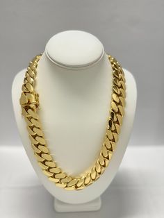 Indulge in the timeless elegance of our Cuban link chains and bracelets, meticulously handcrafted to perfection. Each piece is a solid statement of craftsmanship, created with passion and precision. Our Cuban link collection is plated not once, not twice, but five times with a lavish 14K Gold polish, ensuring a radiant and opulent finish that exudes sophistication. Embrace the uniqueness of handmade jewelry, where each link is carefully assembled to create a one-of-a-kind masterpiece. Our commitment to craftsmanship ensures that every detail is thoughtfully considered, providing you with a timeless accessory that stands the test of time. Please note that the artisanal nature of our creations means that some pieces may take up to 4 weeks to be crafted with the utmost care. Additionally, as Luxury Jewelry Cuban Link With Solid Construction, Luxury Chunky Chain Cuban Link Necklace, Luxury Gold Cuban Link Diamond Necklace, Luxury Diamond Cuban Link Necklace With Curb Chain, Luxury Silver Cuban Link Jewelry, Elegant Luxury Cuban Link Necklace With Chunky Chain, Luxury Elegant Cuban Link Necklace With Cubic Zirconia, Luxury Cuban Link Jewelry With Pave Setting, Luxury Cuban Link Necklace In Cubic Zirconia