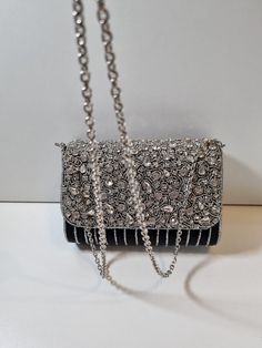 A stunning clutch purse in a beautiful black. A statement piece that will make any outfit. Photos do not do it justice. Chic Evening Bag With Bling For Night Out, Chic Silver Clutch Shoulder Bag, Embellished Black Clutch Bag, Black Embellished Clutch Bag, Chic Black Evening Bag With Rhinestones, Black Evening Bags With Bling, Chic Silver Shoulder Bag For Formal Occasions, Chic Clutch Shoulder Bag With Rhinestones, Chic Rhinestone Clutch Shoulder Bag