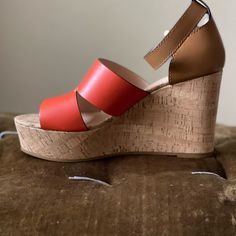 The Brand New Coach Isla Cork Platform Wedge Sandals Are Sure To Catch Some Double Takes With This Red/Orange And Brown Two Tone Color Blocking. Perfect For The Summer Time, These Are A Win For You Wardrobe! True To Size And Extremely Comfortable! New Without Box Red Leather Wedge Sandals For Summer, Red Block Heel Wedge Sandals For Summer, Red Wedge Sandals With Heel Strap For Beach, Orange Wedge Sandals For Summer, Orange Platform Sandals With Ankle Strap, Red Leather Wedge Sandals, Orange Synthetic Wedge Sandals With Round Toe, Chic Orange High Heel Wedge Sandals, Red Open Heel Wedge Sandals For Spring