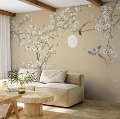 the living room is decorated with white flowers and birds