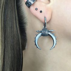 Available as SINGLE or PAIR Eye catching large Moon with spikes hoop earrings are made of 316 Stainless steel . Moon charm has semi Matt finish. Moon charm is detachable from the hoop. Hoop inner diameter: 10mm Moon size: 28mm wide, 29mm long Hoop size : 41mm total length Ships in a gift box *RETURNS / REFUNDS * -If you would like to return you purchase , please contact us within 7 days of receiving your package and we will accept the return.Return will only be made to the product, and not the shipping cost.  -Buyer is  responsible for the return shipping costs . -All jewelry must be returned unworn and in their original condition . *LOST MAIL* Once the package is marked as DELIVERED by the post office, we are not responsible for misplaced or stolen packages. *MAIL THEFT* If parcel is stol Black Hoop Earrings, Spike Hoop Earrings, Black Hoops Earrings, Celtic Earrings, Spike Earrings, Unique Bracelets, Moon Charm, Earrings Black, Black Earrings