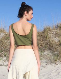 Style – The Utility tank is a basic scoop neckline in front and back that is highly functional. Shape – The Simplicity follows the shape of the torso, opening up into a simple A-line design at the hip. Size – Order based on your BUST measurement Fabric Shown – Light Hemp/Organic Cotton Knit Color Shown – Spinach Fitted Spring Tank Top With Scoop Back, Fitted Scoop Back Tank Top For Spring, Fitted Cotton Tank Top With Scoop Back, Fitted Tank Top With Scoop Back, Spring Stretch Tops With Low Back, Spring Low Back Stretch Tops, Fitted Summer Tank Top With Scoop Back, Fitted Scoop Back Tank Top For Summer, Scoop Back Crop Top For Spring