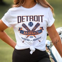 Please read the description completely and review all photos before ordering. Our Detroit Baseball Apparel is the perfect way to cheer on the home team this season. Ideal for game day, tailgates or everyday wear. Makes a great gift for any fan. This listing is for the distressed design. Click the link below for the non-distressed version: https://tandtapparel21.etsy.com/listing/1672213846/vintage-style-detroit-baseball-t-shirt SHIRT DETAILS Bella Canvas Unisex - Solid colors: 100% Cotton. - Heather colors: 52% Cotton + 48% Polyester - Runs true to size. (For looser or oversized fit consider going up a size or 2. See photos for size chart.) SWEATSHIRT & HOODIE DETAILS Gildan Heavy Blend Unisex - 50% Cotton + 50 Polyester - Runs true to size. (For looser or oversized fit consider going up a Baseball Apparel, Hoodie Details, Baseball Outfit, Sports Hoodies, Baseball Fan, Home Team, Sweatshirt Hoodie, Baseball Tshirts, Game Day