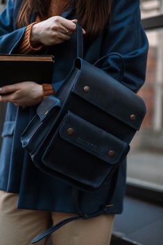 Model INGI Dark Blue Crazy Horse Leather Women's Backpack: Small Daily Pack and City Rucksack Elevate your style with our Dark Blue Crazy Horse Leather Women's Backpack. Crafted from premium Crazy Horse leather, this backpack boasts a vintage finish that gets better with time. It's designed to be your ideal companion for city adventures, daily commutes, and casual outings. Features: * Premium Leather: Made from high-quality dark blue Crazy Horse leather, ensuring durability and a unique, vintage look. * Compact Size: Perfect for daily use with dimensions of 20 x 25 x 12 cm, offering ample space without being bulky. * Multiple Compartments: Organized storage with several pockets to keep your essentials neatly arranged. * Comfortable Carry: Adjustable straps provide a comfortable fit for all Blue Student Satchel With Adjustable Strap, Blue Travel Backpack With Pockets, Large Capacity Blue Leather Backpack, Blue Shoulder Bag For Travel And Back To School, Blue Backpack For Everyday Use And Back To School, Adjustable Strap Leather Backpack For Students, Blue Shoulder Bag For Back To School Travel, Blue Standard Backpack For Travel, Large Capacity Blue Satchel Backpack