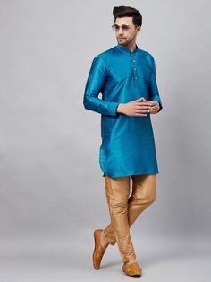 VM By VASTRAMAY Men's Turquoise Blue Silk Blend Curved Kurta Pant Set Elevate your traditional wardrobe with the VM By VASTRAMAY Men's Turquoise Blue Silk Blend Curved Kurta Pant Set. This exquisite ensemble combines elegance and comfort, making it perfect for festive occasions and celebrations. The kurta features a curved hemline and is crafted from a luxurious silk blend, offering a rich texture and a sophisticated look. Key Features Rich turquoise blue color Curved hemline design Comfortable Traditional Blue Pants For Festive Occasions, Traditional Blue Pants For Festive Season, Traditional Blue Festive Pants, Blue Traditional Festive Pants, Traditional Fitted Turquoise Kurta, Fitted Turquoise Kurta For Festive Occasions, Fitted Turquoise Traditional Wear For Diwali, Fitted Turquoise Traditional Wear, Festive Fitted Turquoise Kurta