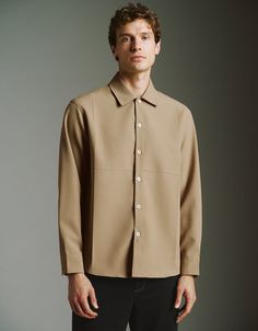 Fall Button-up Tops With Hidden Button Closure, Modern Button-up Tops With Hidden Button Closure, Beige Single Breasted Relaxed Fit Tops, Beige Single Breasted Top With Relaxed Fit, Beige Single-breasted Top With Relaxed Fit, Everyday Outerwear With Lapel Collar And Buttons, Tailored Tops With Button Closure For Work, Tailored Workwear Top With Button Closure, Everyday Outerwear With Buttons And Lapel Collar