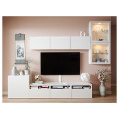 a white entertainment center with shelves and drawers in front of a flat screen tv mounted on a wall