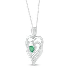 This pretty necklace for her features a double heart-shaped pendant traced in shimmering diamond accents. At the center sits a beautiful heart-cut lab-created emerald to complete the romantic design. The sterling silver pendant is suspended from an 18-inch box chain and secures with a lobster clasp. Emerald Heart Charm Jewelry, Silver Heart Cut Necklace For May Birthstone, Heart-shaped Emerald Jewelry For Valentine's Day, Heart-shaped Emerald Jewelry For May Birthstone, Heart-shaped Emerald Jewelry With Birthstone, Heart-shaped Emerald Necklaces For Anniversary, Heart-shaped Emerald Birthstone Jewelry, Heart-shaped Emerald Necklace For Anniversary, Anniversary Heart-shaped Emerald Necklace