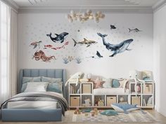 a bedroom decorated in pastel colors with sea animals on the wall