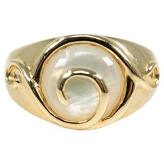 In 14 karat yellow gold, this ring is centered with one circular mother-of-pearl inlay. Elegant Gold Rings With Mother Of Pearl, Elegant Mother Of Pearl Round Rings, Elegant Round Mother Of Pearl Ring, Yellow Gold Oval Pearl Ring With Polished Finish, Oval Mother Of Pearl Ring With Polished Finish, Classic Mother Of Pearl Round Rings, Classic Mother Of Pearl Rings, 14k Gold Pearl Ring With Polished Finish, Gold Mother Of Pearl Anniversary Rings