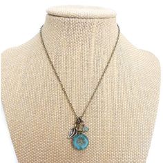 Brand New, Still In Box! Romantic Charm Necklace With An Aqua Blue Hawaiian Flower Bead That Is Delicately Carved In The Center Surrounded By A Small Antiqued Bronze Etched Leaf And An Opaque Off-White Bead. All Of The Charms Are Suspended On A Bronze Chain And Finished With A Lobster Clasp. Charm Cluster Is 1.25" (3 Cm) Long. Chain Is 25" Long (12.5" Drop). Handmade By An Artist Out Of New Jersey! Blue Bohemian Necklace With Flower Charm, Adjustable Blue Necklace With Flower Charm, Bohemian Blue Flower Pendant Jewelry, Bohemian Flower Charm Necklace For Gifts, Bohemian Flower Charm Necklace As Gift, Bohemian Flower Charm Necklaces As Gift, Bohemian Flower Charm Necklace As A Gift, Bohemian Style Flower Charm Necklace As Gift, Bohemian Turquoise Charm Necklace For Gift