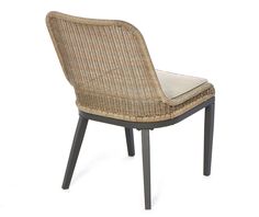 a wicker and metal dining chair with cushion on the backrest, viewed from the side