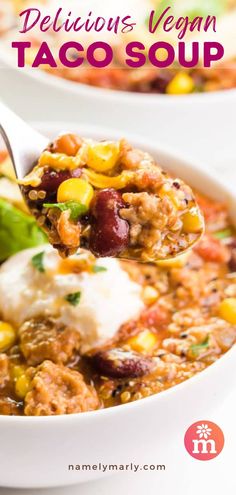 a spoon full of taco soup with meat and vegetables in it, on top of a white plate