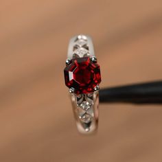 It is a natural garnet ring, octagon cut, measures 7mm*7mm, weight about 2.48 cts. The basic metal is sterling silver and plated with rhodium.To change the metal to a solid gold (white/rose) or platinum is also available, please ask for a quotation if you want.You can also go to my shop Home for more elegant rings: https://www.etsy.com/shop/godjewelry?ref=hdr_shop_menuGarnet is birthstone of January.More Garnet rings:https://www.etsy.com/shop/godjewelry?ref=seller-platform-mcnav&section_id=2 Elegant Emerald Cut Lab-created Ruby Jewelry, Elegant Emerald-cut Lab-created Ruby Jewelry, Silver Octagon Crystal Promise Ring, Octagon Shaped Sterling Silver Topaz Ring, Red Asscher Cut Diamond Jewelry, Asscher Cut Ruby Fine Jewelry, Asscher Cut Ruby Ring Gift, Emerald Cut Garnet Promise Ring, Garnet Emerald Cut Promise Ring