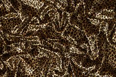 an animal print fabric with brown and black spots