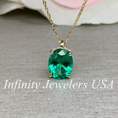 "The pendant pictured is lab created emerald #6259 Shown in 14k white gold and 14k yellow gold -Approximate total carat weight: approx. 2.10ctw diamond equivalent -Center Stone Size: 9x7mm - approx. 2.10ct diamond equivalent -Center Stone Shape: oval -Gem Type: lab created emerald -Stone Clarity: VS2 -Stone Color: green -Moh's Scale: 8.5 hardness -Metal Type and Purity: 14k yellow gold -Setting: 4 prong basket head -Chain: delicate 14k gold chain / heavier option with lobster claw available (use Gold Necklace Emerald, Emerald Pendant Necklace, Emerald Necklace Pendant, Necklace Emerald, Oval Necklace, Head Chain, Necklace Bridal, Solitaire Necklaces, Emerald Pendant