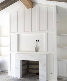 an instagram photo of a fireplace in a white room