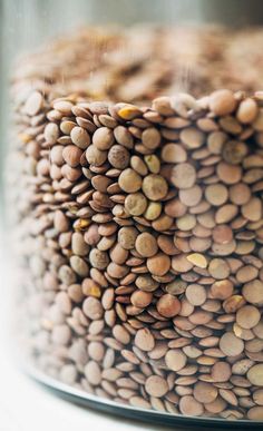 a close up view of a cake with nuts on the top and bottom tiers