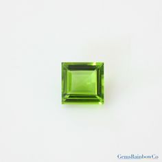 a square shaped green gems on a white background