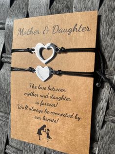 "Our adorable mother and daughter bracelet set is perfect as a gift or for you to share with your mother or daughter :) A special way for you to think of each other- even when you are apart. 💕 Material - Made of High-Quality Nylon Black Cord and heart charms 💕 Adjustable Size - The length is 4\"-9\", you can adjust the size through a sliding knot to fit even the largest or smallest of wrists Beautiful and adjustable, perfect for special events or on the go!" Adjustable Meaningful Jewelry For Mother's Day, Meaningful Adjustable Jewelry For Mother's Day, Mother's Day Double Heart Friendship Bracelet, Silver Heart Bracelet For Birthday And Mother's Day, Adjustable Double Heart Bracelet For Gift, Adjustable Double Heart Bracelet Gift, Adjustable Double Heart Bracelets For Gifts, Meaningful Bracelets For Birthday And Mother's Day, Heart Bracelet For Mother's Day Friendship