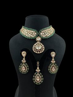 Green Polki Choker emerald Kundan centerpiece surrounded by radiant Kundan Polki stones, crafted in gold with intricate Jadau detailing. Inspired by Sabyasachi, it boasts the brilliance of Moissanite and uncut diamonds, offering a statement of opulent elegance perfect for a grand Indian wedding. *𝐏𝐑𝐎𝐃𝐔𝐂𝐓 𝐃𝐄𝐓𝐀𝐈𝐋* * Material: Brass * Plating: Gold Plated * Stone: Semi Precious Kundan, Polki & Green Stone. *𝐃𝐈𝐒𝐂𝐋𝐀𝐈𝐌𝐄𝐑* Product color may slightly vary due to photographic light Gold Meenakari Diamond Necklace, Gold Diamond Necklace With Meenakari, Emerald Kundan Necklace With Intricate Design For Festive Occasions, Festive Kundan Emerald Necklace For Receptions, Gold Diamond Jewelry With Meenakari, Festive Emerald Kundan Necklace With Intricate Design, Yellow Gold Jeweled Necklace For Wedding, Jeweled Yellow Gold Necklaces For Wedding, Traditional Emerald Jeweled Jewelry