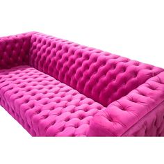 a pink couch sitting on top of a white floor