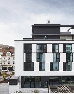 a white and black building with lots of windows