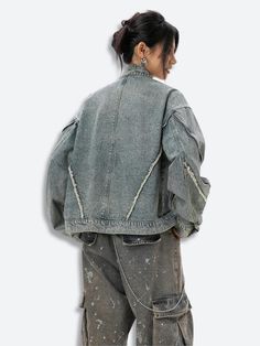 This Cyberpunk Zip-Up Denim Jacket offers a bold, industrial look with exposed seams and distressed detailing. Its oversized fit pairs perfectly with cargo pants or ripped jeans for versatile streetwear style. Cyberpunk aesthetic Denim material Zip closure at front Zip detail at sleeves Button detail at cuffs Tasseled detail Mandarin collar Long sleeve Cotton, polyester Our model wears L and is 5'4 (166cm) Denim Jacket With Zipper Closure For Streetwear, Denim Blue Denim Jacket With Zipper Closure For Streetwear, Dark Wash Denim Jacket With Button Closure For Streetwear, Single-breasted Denim Outerwear For Streetwear, Utility Denim Outerwear Pre-washed, Style Cyberpunk, Fall Sweaters For Women, Crop Pullover, Jogger Pants Casual