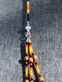 Southwestern Style Beaded Dangle Jewelry, Multicolor Southwestern Beaded Necklace With Dangling Beads, Artisan Beaded Necklaces With Dangling Round Beads, Spiritual Festival Jewelry With Dangling Beads, Southwestern Dangling Beads For Jewelry Making, Artisan Multi-strand Jewelry With Tiny Beads, Traditional Beaded Lariat Jewelry, Southwestern Adjustable Jewelry With Colorful Beads, Southwestern Style Colorful Beads Dangle Jewelry