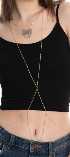 Product Features: Material: High-quality steel with gold-toned plating Details: Finely handcrafted gold-toned chains with sphere details Length: Neck: 46 cm Body (from nape): 44 cm Hips: 102 cm Waist: 42 cm Description:  Elevate your elegance and allure with this exquisite handmade body chain. Crafted from premium steel and finished with eye-catching gold-toned plating, this delicate and elegant body accessory is designed to add a subtle yet striking touch to your style. This unique body chain pairs perfectly with swimsuits and bikinis for a dazzling beach look during the day and with evening gowns for a glamorous night out. It enhances your elegance both day and night, drawing attention in any setting. Usage: Dazzle at the Beach: Wear over swimsuits and bikinis to attract all eyes on the Adjustable Chain Strap Jewelry For Festivals, Gold Plated Delicate Chain Jewelry For Party, Party Jewelry With Delicate Gold Plated Chain, Party Gold Plated Jewelry With Delicate Chain, Gold Chain Strap Jewelry For Festivals, Gold Jewelry With Chain Strap For Festivals, Elegant Gold Chain Body Jewelry For Gift, Long Gold Chain Necklace For Parties, Gold Plated Chain Necklace With Adjustable Chain For Party