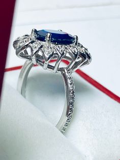 Beautiful 14k White Gold Natural Sapphire and Diamond Ring : Natural Sapphire: 3.12 CT Side Diamonds: 0.50CT Color: G Clarity: SI1 Total ring weight: 6.2GR 14K White Gold Free Ring sizing available For more information regarding this item feel free to reach me so I can accommodate your needs. Thank you 14k White Gold Ruby Ring With Halo Setting, Gia Certified Sapphire Cluster Jewelry, Fine Jewelry With Gia Certified Marquise Cut, Formal 14k Gold Gia Certified Diamond Ring, 14k White Gold Emerald Cut Halo Ring, Gia Certified 14k Gold Cluster Ring, Gia Certified 14k Gold Diamond Ring For Formal Occasions, Gia Certified Marquise Cut Fine Jewelry, Gia Certified Marquise Fine Jewelry