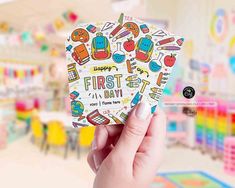 someone is holding up a card that says happy first day with colorful stickers on it