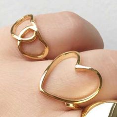 Material: Titanium Steel Fashion Element: Love Heart/Heart Shape Style: Cartoon Adjustable Gold Midi Rings For Valentine's Day, Adjustable Heart-shaped Couple Rings For Valentine's Day, Adjustable Metal Heart Ring For Valentine's Day, Gift Gold Alloy Midi Rings, Metal Heart Ring As Gift, Gold Alloy Midi Rings As Gifts, Trendy Heart-shaped Rings For Valentine's Day, Heart-shaped Metal Ring Gift, Trendy Heart-shaped Wedding Rings