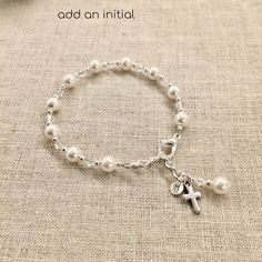 "This lovely Swarovski pearl and crystal bracelet is sure to be the perfect gift. -Bracelet measures 5 ½ inches plus a 1 inch extension chain. -The bracelet includes a pearl & crystal dangle and a cross. This bracelet has been a big seller for First Communion, Confirmation, Easter, Flower Girls, Maid-of-Honor, Bridesmaids, Mother-of-the-Bride, Godmothers, and Brides. Please see other listing for adult size. Necklace is a perfect match. -Necklace measures 13 ¾\" and has a 1\" extension chain. Elegant Personalized Jewelry For First Communion, Adjustable Pearl Drop Bracelet For Gift, Adjustable Pearl Drop Bracelet As Gift, Elegant Personalized Bracelets For First Communion, Elegant Rosary Bracelet For First Communion With Round Beads, Elegant Rosary Bracelet With Round Beads For First Communion, Silver Elegant Rosary Bracelet For First Communion, Elegant Silver Bracelet For First Communion, Elegant Silver Bracelets For First Communion