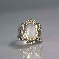 "Moonstone Ring, Garnet Ring, 9K Yellow Gold Hammered Queen Ring in Sterling Silver Band, Gemstone Ring, Antique Style Ring, Chunky Ring This garnet and moonstone ring looks like it was made for a queen. It is ornate but delicate, statement piece but not oversize. The band is adjustbale to any finger size and made of sterling silver set with dark red natural garnet gemstone. The center is a bezel set moonstone gemstone and 9K solid gold, welded on sterling silver, hammered around the moonstone. Queen Rings, Antique Style Rings, Magical Stones, Chunky Ring, Chunky Rings, Ring Antique, Garnet Ring, Garnet Rings, Garnet Gemstone