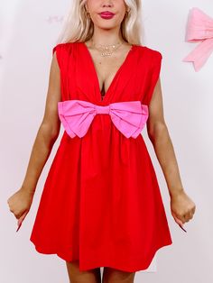 Bow Me Away Red Dress | Sassy Shortcake | sassyshortcake.com Playful Pink V-neck Dress, Red Sleeveless Dress With Bow, Pink Mini Dress With Bow Tie Back, Flirty Pink Dress With Bow, Flirty Pink Mini Dress With Bow, Playful Red Party Dress, Pink Sleeveless Mini Dress With Bow Tie Back, Summer V-neck Mini Dress With Bow, Summer Party Dress With Red Bow