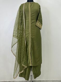 Indian Wedding Wear Salwar Kameez / Indian Ethnic Dress / Plus Size Silk Kurta Dress Traditional Indian Wear / Salwar Kameez Dupatta / Kurti Palazzo Set / Party Wear/ Silk Kurta Set ITEMS DETAILS:- Olive Green Sequinned design Kurta with Trouser and Dupatta Kurta design: * Sequinned Work  * Straight shape * Regular style * Band Neck  * Three-quarter regular sleeves * Calf length with straight hem * Silk blend woven fabric Palazzos design:  * Solid Trousers 1 Pocket  * Partially elasticated waistband * Slip-on closure Dupatta length: 2 metres (approx.)  Top fabric: Silk Blend Bottom fabric: Silk Blend Dupatta fabric: Net Hand Wash NOTE:- please see the size chart in the image to choose a perfect size. Please feel free to ask any question regarding this item. WE ALSO ACCEPT CUSTOMISATION AS Silk Kurta With Dupatta In Pista Green, Pista Green Cotton Silk Kurta With Dupatta, Anarkali Kurta In Pista Green With Dupatta, Anarkali Kurta With Dupatta In Pista Green, Pista Green Kurta With Dupatta In Cotton Silk, Pista Green Anarkali Kurta With Dupatta, Pista Green Cotton Silk Palazzo Set With Straight Kurta, Designer Pista Green Kurta For Navratri, Transitional Pista Green Palazzo Set With Dabka Work