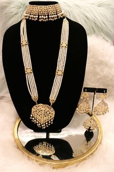 Handcrafted with love to give a real traditional look for this set beautifully studded with jadau stones and pearls give a royal look. Includes: Choker, Rani Haar, Earrings, and Tikka Rani Set Gold, Rampuri Jewellery Set, Jadau Rani Haar, Rani Haar Gold Design, Elegant Hand Set Traditional Wear For Diwali, Elegant Meenakari Jewelry Sets For Festive Season, Elegant Gold Kundan Traditional Wear, Elegant Kundan Traditional Wear For Diwali, Elegant Meenakari Traditional Wear As A Gift