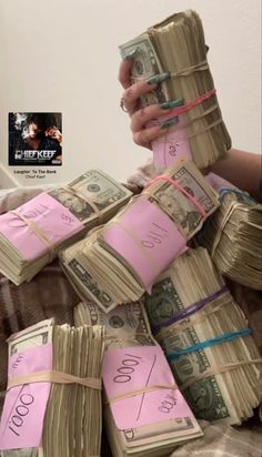 a pile of money wrapped in pink paper